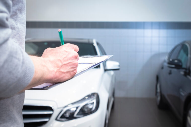 Vehicle inspection during an auto body repair estimate with damage and repair details being documented